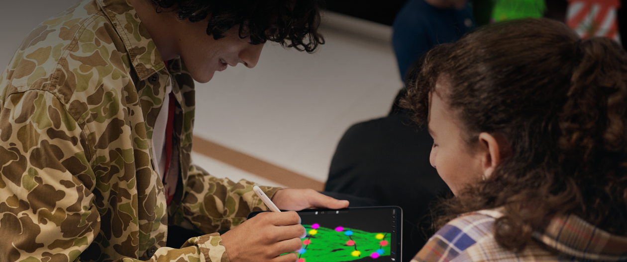 Someone drawing a Christmas tree on iPad during a Today at Apple session